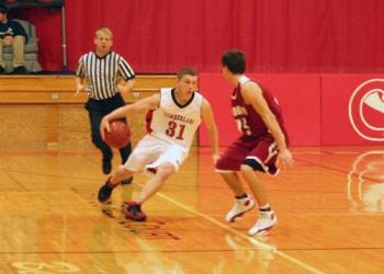 Breaking the press in a basketball game - This photo was taken with a Canon Rebel Xt using a 50mm f1.8 lens using an ISO of 1600 and using only available light