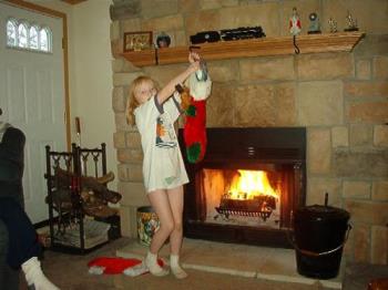 My daughter taking her stocking down to empty.  - I love my fireplace. 