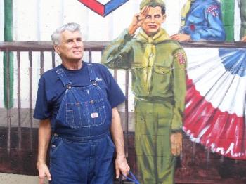 Oklahoma Centennial - My dad alongside a mural painted from a photo of him as a young Boy Scout.