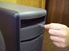 Eject the Tray - Just insert a pin in to the hole of optical drives to eject the tray.