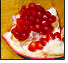 pomegranite fruit section - pomegranite seeds have a luscious pulp around them - their juice is highly prized for its healthy benefits.