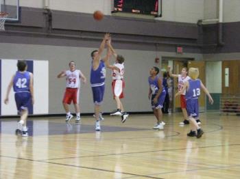 Basketball Game - This photo was shot with the Canon S5 using available light. It was a hand held shot with the image stabilization on. I was shooting with the ISO of 400 and the zoom about 100mm.