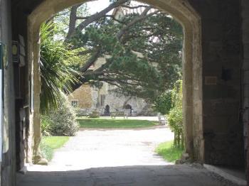 Michelham Priory - A view through the inner gate of the Gate House, straight ahead to the Priory. Michelham Priory - A view through the inner gate of the Gate House, straight ahead to the Priory.