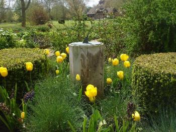 Michelham Priory - Sundial Garden - A sundial, set in a small garden planted with mainly yellow flowers. There's a very solid, wooden bench between the moat and the garden... an excellent place to watch time go by in thought of days gone by. Michelham Priory - Sundial Garden - A sundial, set in a small garden planted with mainly yellow flowers. There's a very solid, wooden bench between the moat and the garden... an excellent place to watch time go by in thought of days gone by.