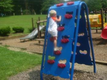 Life - Sky climbing the playground wall..what a monkey! lol