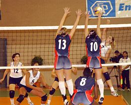 volleyball sports - Volleyball is an Olympic team sport in which two teams of six active players, separated by a high net, each try to score points against one another by grounding a ball on the other team&#039;s court under organized rules.[1]

