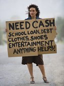 Woman needing cash for debt - photo of woman with sign need cash for much needed things