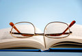 reading glasses - photo of reading glasses on book