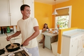 Man cooking in kitchen - photo of Man cooking in kitchen