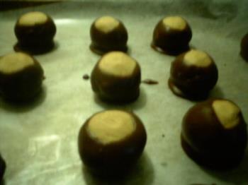 Peanut butter buckeyes - This is what the finished product looks like. Not a great picture, but you get the idea. Peanut butter buckeyes - This is what the finished product looks like. Not a great picture, but you get the idea.