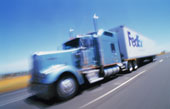 Fed Ex truck - photo of Federal Express truck and trailer speeding along California highway