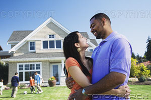 couple with kids -  a happy couple with their kids playing