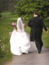 wedding - a newly wed couple running