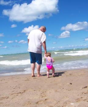 Walking the Beach - This is a picture of my husband and my daughter when we were at the Indiana Dunes Beach. 