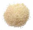 grits - Grits are made from white hominy and coarsely ground. 
Hominy is made from corn with the hulls removed
