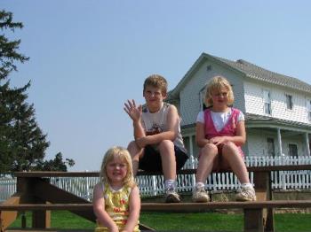 Should I change? - My kids sitting on the bleachers at the Field of Dreams in Iowa. what do you think? Should I change my photo to this one?