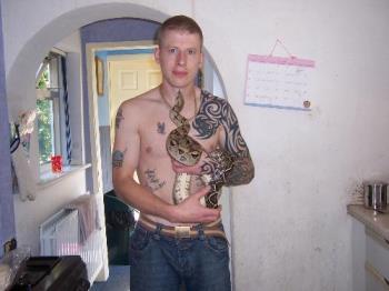 Hubbys pet Boa - My hubby holds his pet boa constrictor in his hands, this snake absolutely adores my hubby and loves it when he gets her out.