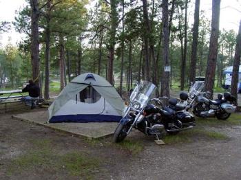 Motorcycles, trees, and tent - Motorcycles, trees, and tent This is the un-altered mystery photo. Motorcycles, trees, and tent - Motorcycles, trees, and tent This is the un-altered mystery photo.