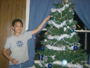 Christmas Tree - My oldest decorating our tree last year.