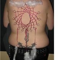 Back Piercing - A girlfriend of mine piercing on her back Back Piercing - A girlfriend of mine piercing on her back