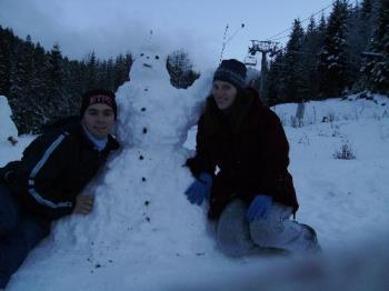 Snowman and us - This is our made snowman for 30.11.2008 and the camera was on a hand made of snow tripod while taking this picture.