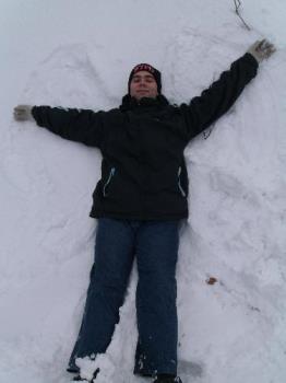 Me making a snow angel - This is a picture of a snow angel in progress.