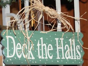 deck the halls - my little wood sign hangs above the doorway between kitchen and dining room