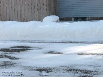 Snow Bank - The drives edge showing the area of blown snow.