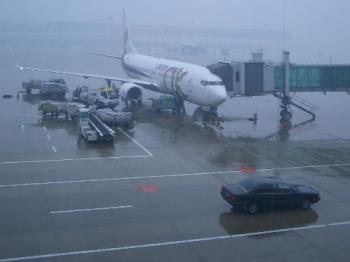 this is the flight in Hangzhou Xiaoshan Internatio - This is the flight in Hangzhou XiaoShan International Airport. I was at the airport taking a flight back to my hometown. It was starting to snow that day in late January 2008.