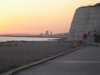 Sunset Over Brighton Marina - A picture I took from Undercliff Walk, near Brighton, in England. It shows the sun setting over Brighton Marina and the southern tip of Brighton.