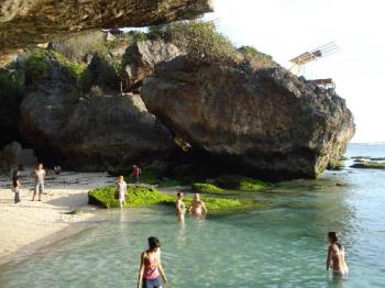 Uluwatu beach - Uluwatu beach under rocks 1