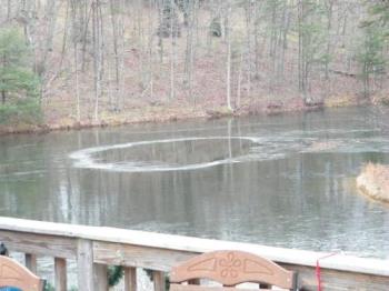 The Ring - My husband took this shot of our lake from our deck. The ice was melting and formed this "ring" which reminded him of the move called "The Ring"... kinda spooky! LOL