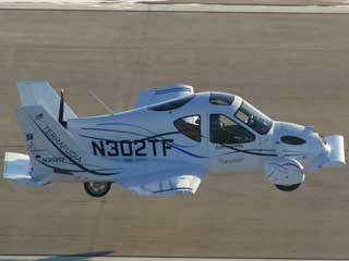 Flying Car - This a photo of what is called a flying car which it really isn&#039;t but is a plane that has wings that folds up but can be driven on roads like a car..