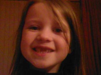 All I want for Christmas! - Niamh with her 2 front teeth missing!