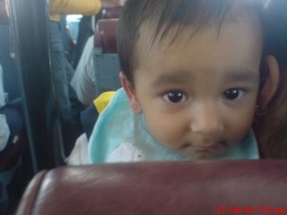a listening baby - a beautiful baby listening to someone