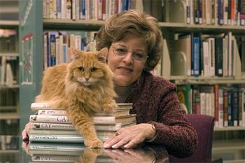Dewey - Dewey the library cat. Pick up the book "Dewey" to read about this amazing cat that turned a failing library around and put their town on the map. Very heartwarming and very sweet story. 