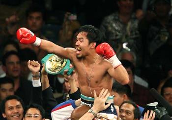 Victorious - Manny Pacquiao wins. KOs Ricky Hatton at Round 2. 