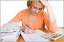 worried with bills - illustrates the usual monthly picture of a wife finding out the monthly / weekly / daily budget.