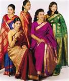 Saree by Indian women - A sari or saree or shari is a female garment in the Indian subcontinent. A sari is a 
strip of unstitched cloth, ranging from four to nine metres in length that is draped 
over the body in various styles. The most common style is for the sari to be wrapped 
around the waist, with one end then draped over the shoulder baring the midriff