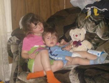 Reading to baby brother - My daughter reading to her younger brother