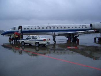 the plane I took in 2008 - Here is a photo I took at the airport, a plane I took on January 26, 2008, when I went to my hometown for the winter vacation on a snowstorm day. I was lucky to get back home before the snow storm arrived. You could see from the picture the heavy cloud in the sky. It was getting darker though it was before ten in the morning. 
