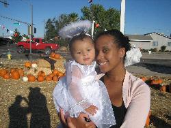 My daughter and I - My daughter and I at the pumpkin patch. She was an angel for Halloween.