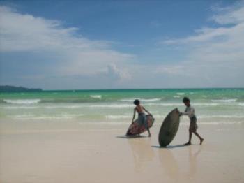 Boracay White Beach - kids playing with their skim board in Boracay, Philippines
