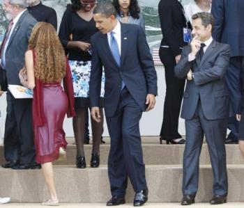 Obama - Is he really interested in helping someone down the steps?