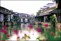 Wuzhen, an old water village (Venice of China) - A beautiful water village that have 1000 years old history.
Many bridges and olden architectures still intact, but the
interior has been turn into high class hotels and restaurant!
The scenery is breathtaking, a place that "MUST' visit :)