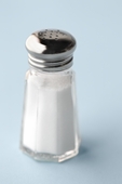 salt shaker - photography of salt shaker sitting on counter