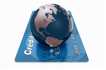 credit card - photo of globe sitting on top of credit card