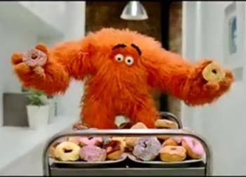 Weight Watchers&#039; Monster - Weight Watchers&#039; Monster holding donuts