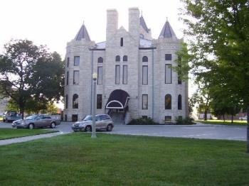 McPherson County Courthouse - Our limestone courthouse is in a lovely setting in Memorial Park in downtown McPherson, and it has a clock tower.