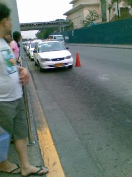 taxis - taxis picking up passengers in a mall